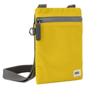 Roka Chelsea Sustainable Nylon Pocket Sling Bag - Mustard Yellow